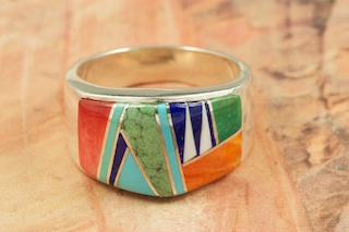 Genuine Sleeping Beauty Turquoise, Spiny Oyster Shell, Magnesite and Blue Lapis inlaid between ribbons of Sterling Silver. Stunning Ring Designed by Navajo Artist Calvin Begay. Signed.